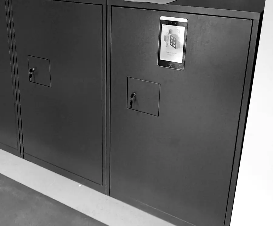 Bike lockers with keyed doors and a touchscreen access panel